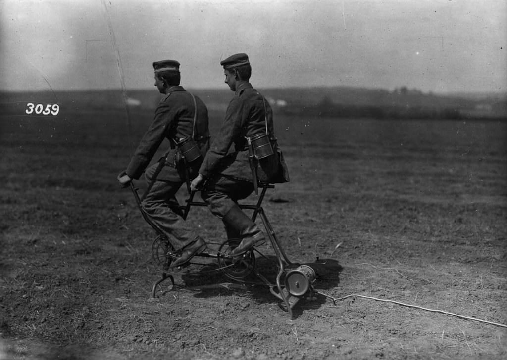 German soldiers generate power to inflate an observation balloon, 1914.