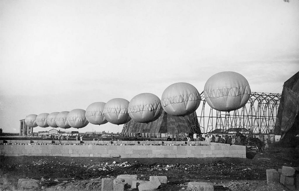 A row of barrage balloons used for suspending aerial nets in Brindisi, Italy, 1918.