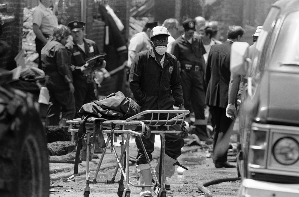 A worker transports the remains of a body found in the rubble.May 15, 1985