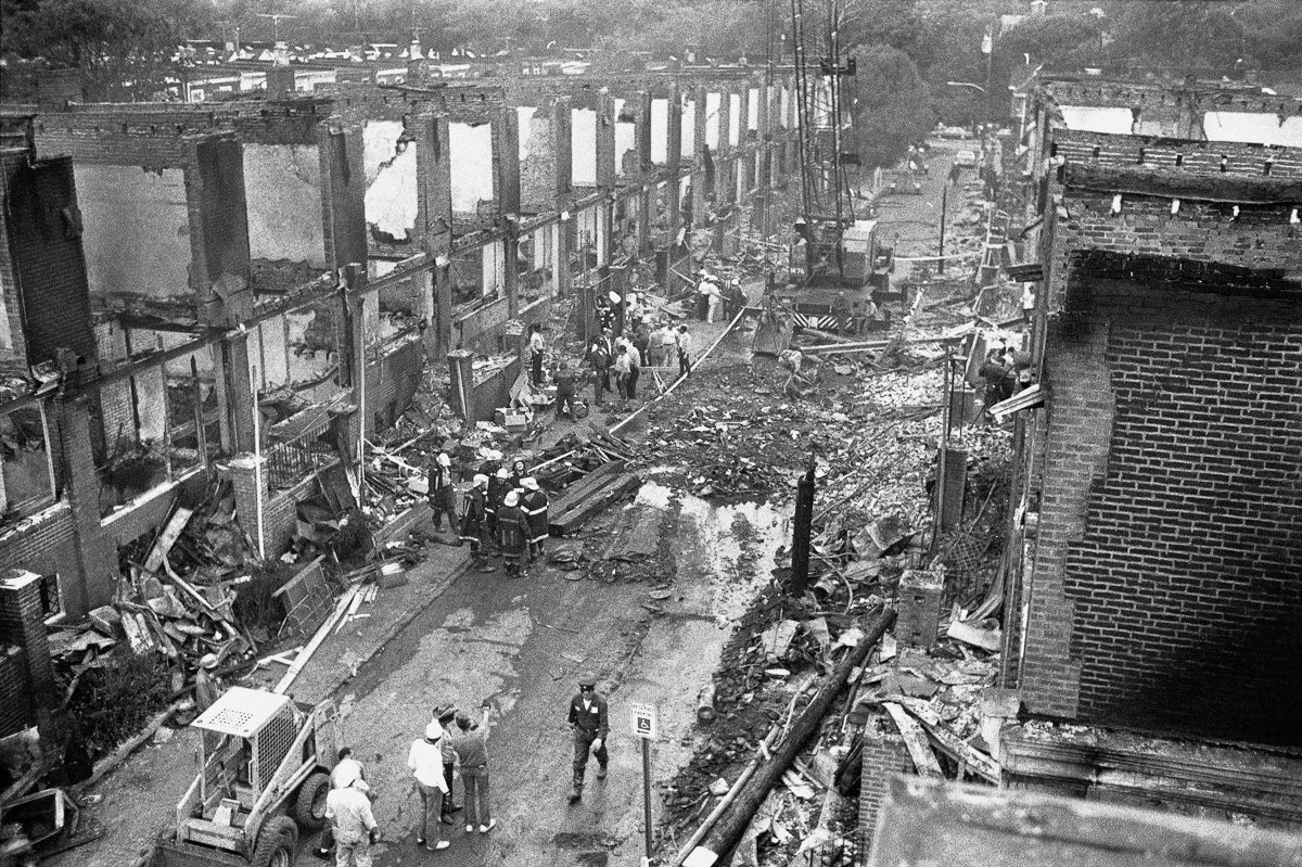 Investigators search the rubble for bodies. May 15, 1985