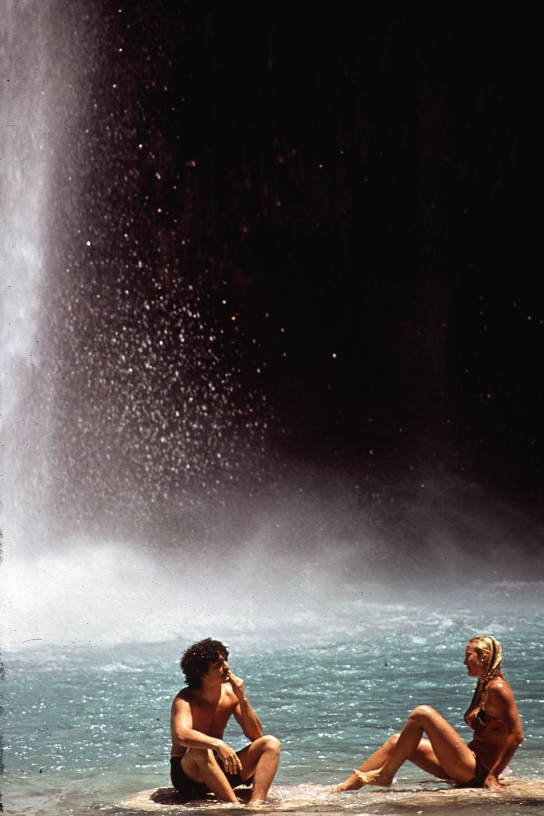 Tourists bath beneath Havasu Falls.
