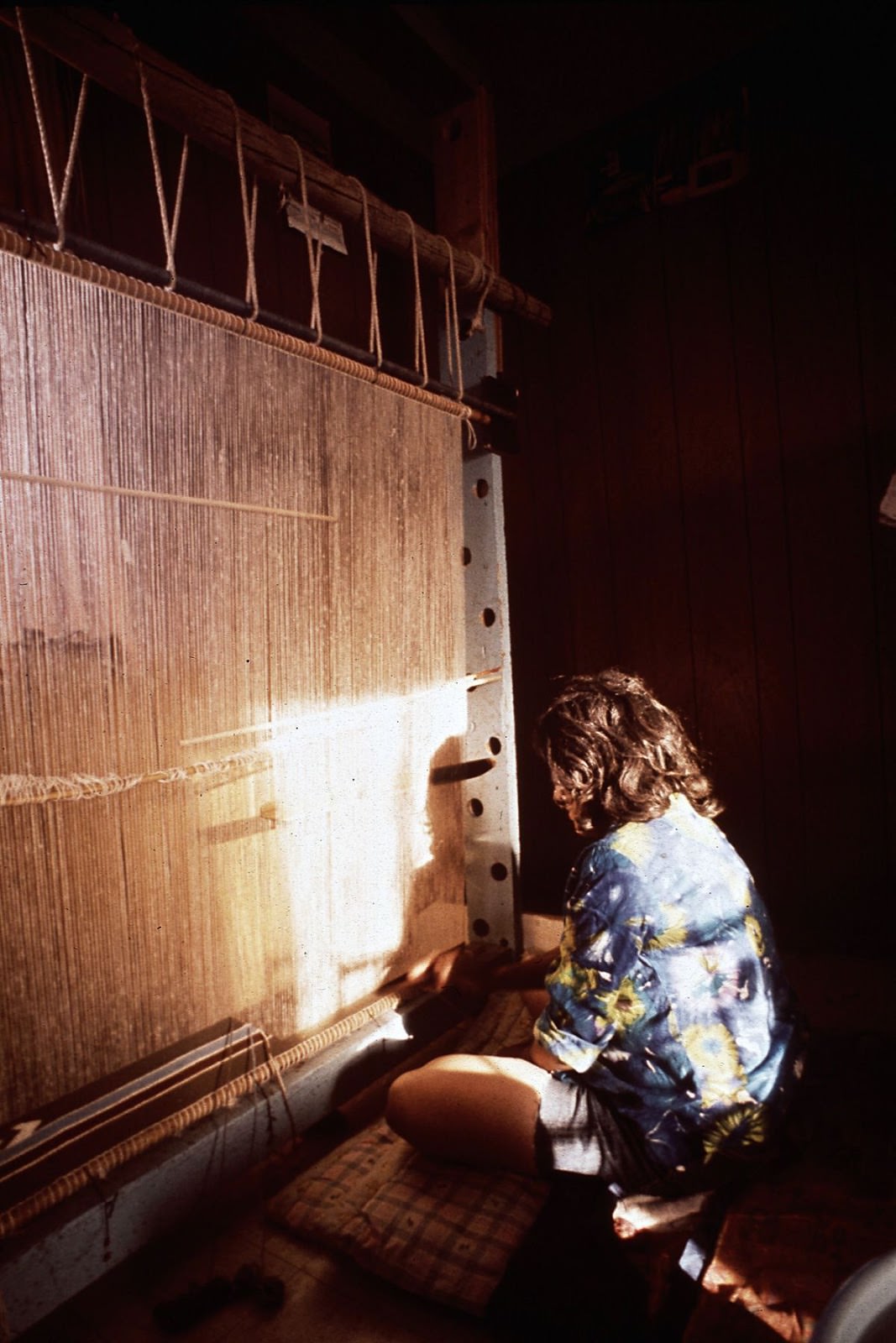 A woman weaves a rug at the Hubbard Trading Post on the Navajo Reservation in Arizona.