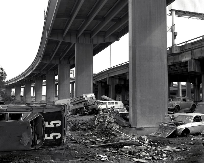 Automobile graveyard beneath the Nimitz Freeway, near 34th St and Wood, Oakland, 1986.