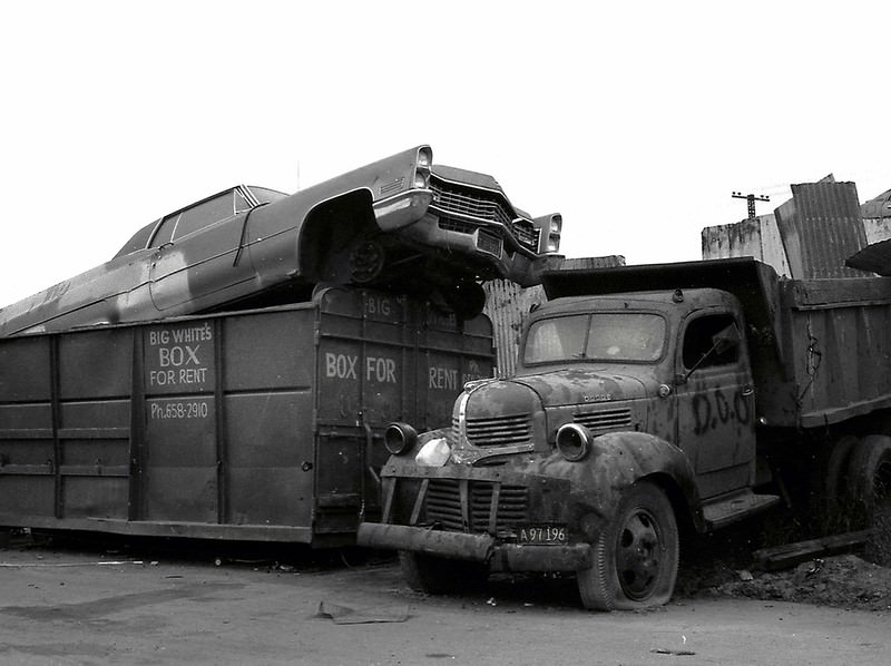 Cadillac in a debris box, 20th century salvage, West Oakland, 1975.