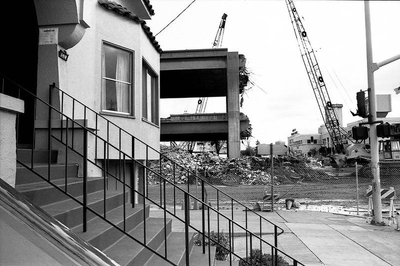 Demolition of the earthquake damaged section of Interstate-880 known as the Cypress Structure. 14th Street & Mandela Pkwy, Oakland, 1989.