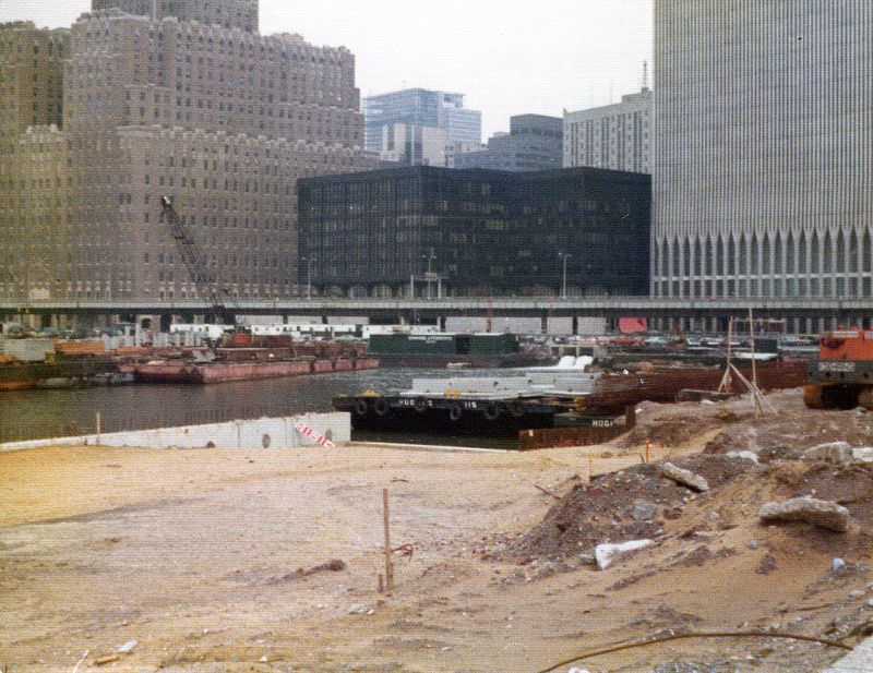 World Trade Center (the dark building at Vesey and West St) from Battery Park City landfill, the West Side Highway crosses the whole view, April 1974