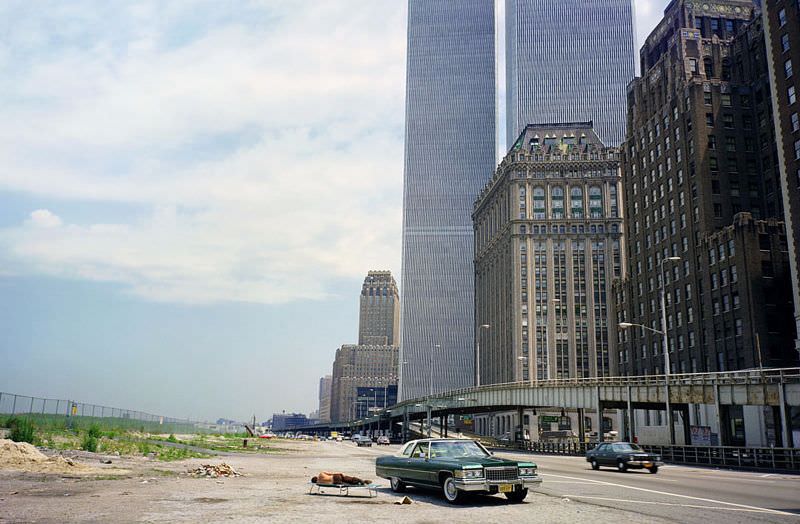 The swampy fields of future Battery Park City, The World Trade Center hovers, New York, August 1976