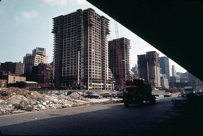 Construction of Independence Plaza North, cobblestoned West Street and Lower Manhattan from under the elevated West Side Highway, New York, June 1973