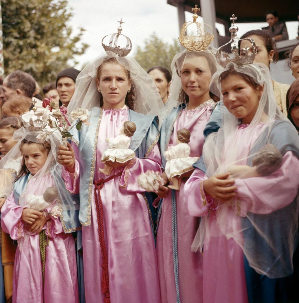 Costumed young women during the procession of a religious festival in the province of Minho, circa 1970, Portugal.