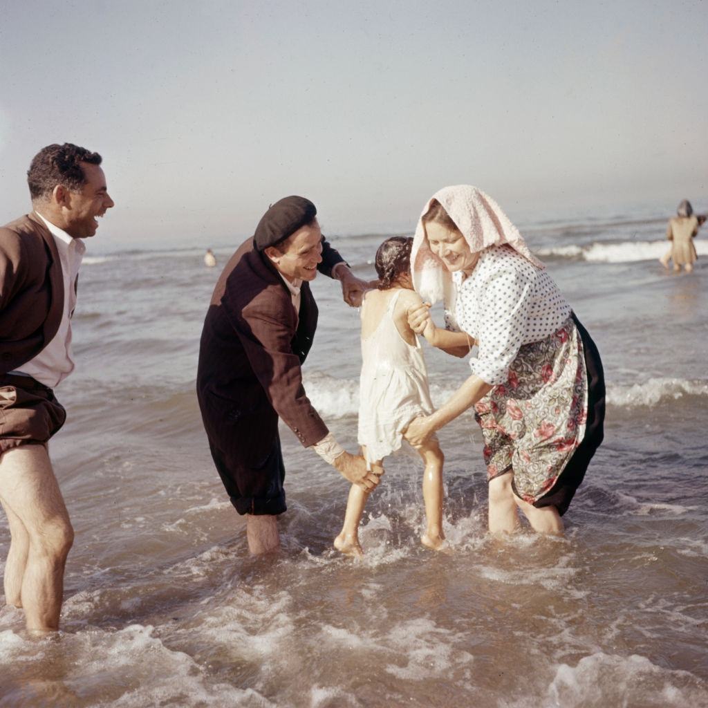 Bathing ritual during a religious festival in Portugal, circa 1970.