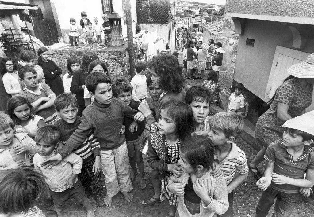 Children in Madeira, boys and girls gathered on a small square, 1971.