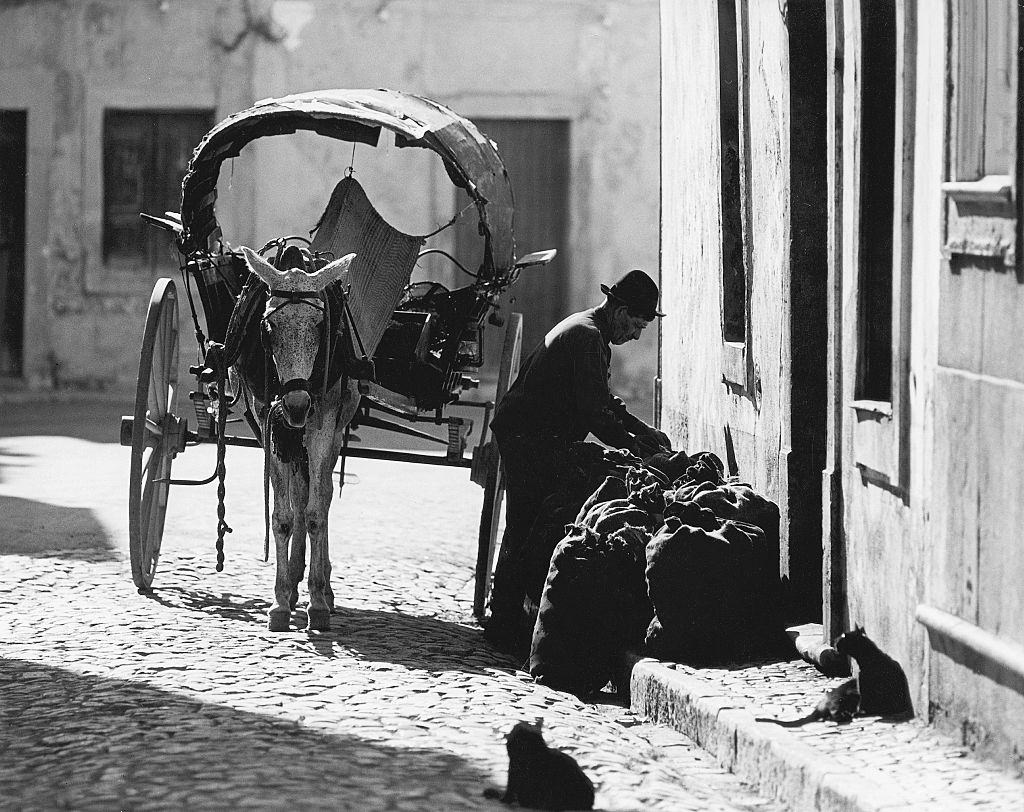 Algarve, coal merchant with donkey cart in Olhao, Portugal, 1970.