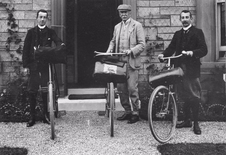 Three men with bikes outside house, 1903. Inscribed beneath: 'As we started from 2 Corrennie Gardens. July 20th 1903.'