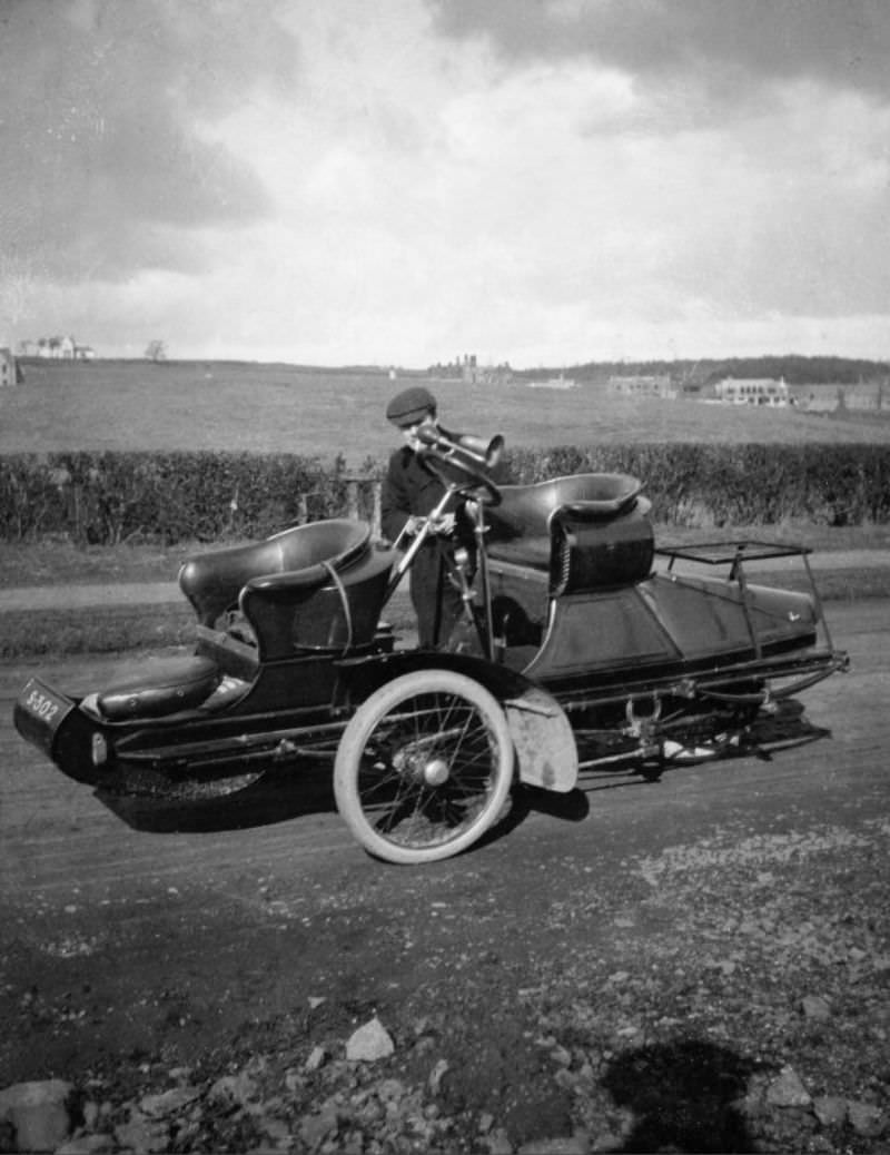 Side view of possible steam car with man, c.1906.