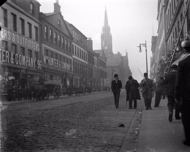 South Bridge, Edinburgh, from South East showing street scene with horses and carts, c. 1910.