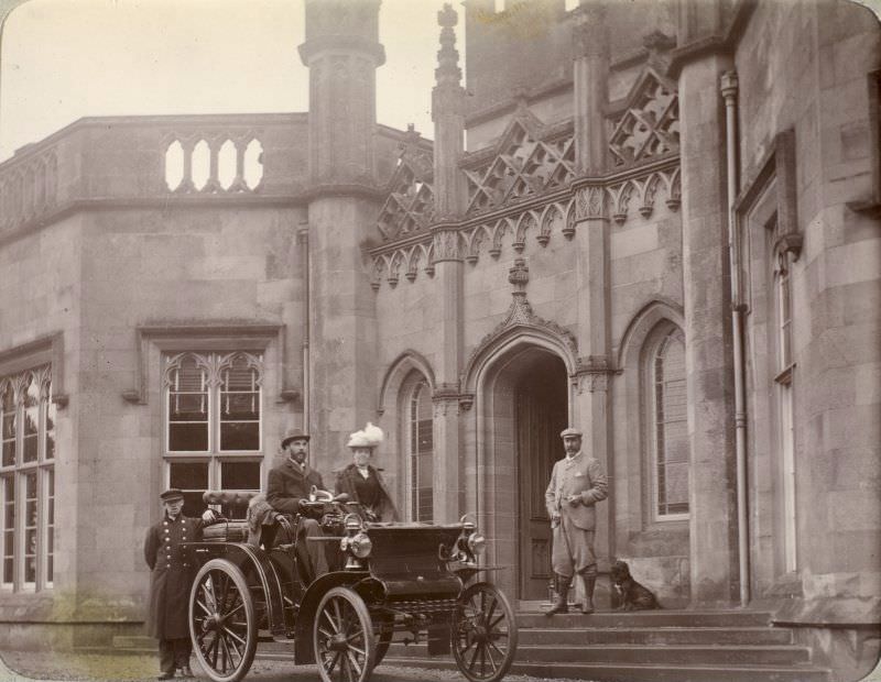 Inchrye Abbey entrance with couple in automobile, c. 1900.