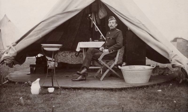 Soldier sitting by his tent, c.1904.