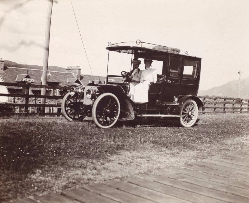 Two women in a car, c.1910.