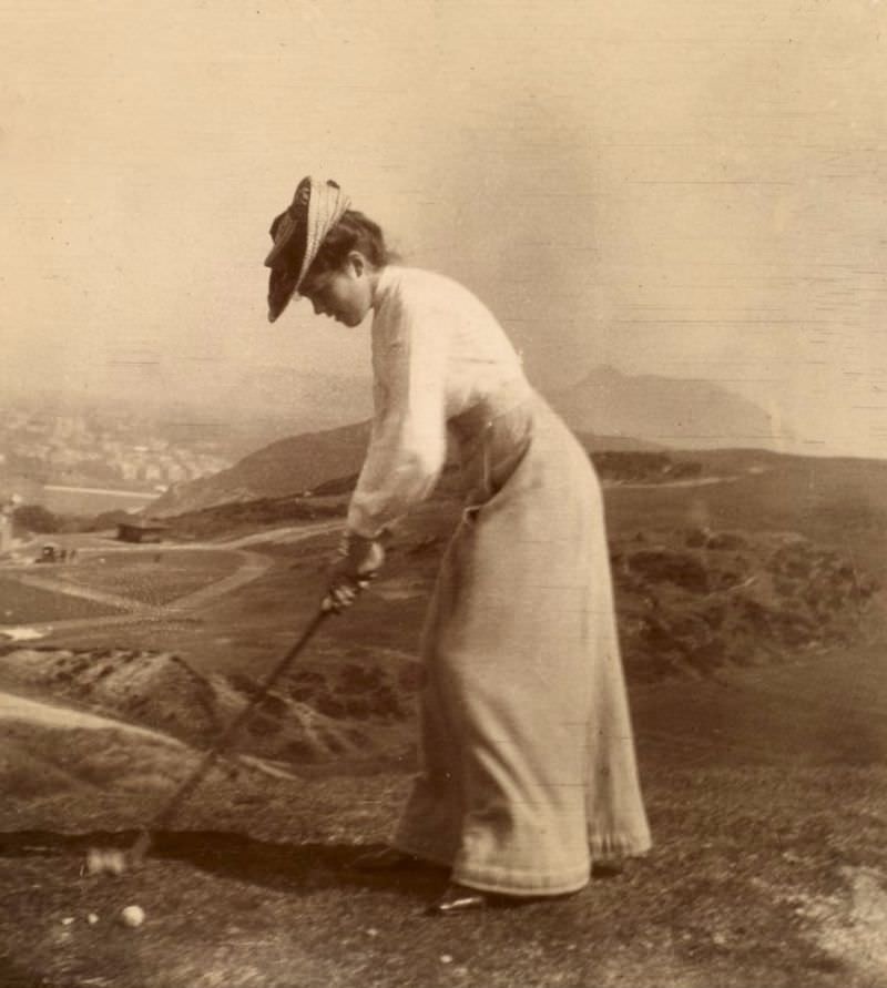 Woman playing golf, 1902. Titled: 'F.J.T Braid Hills 1902'.