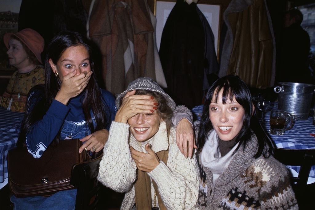 Shelley Duvall with Geraldine Chaplin and Lauren Hutton at a party honoring film director Robert Altman, 1977.