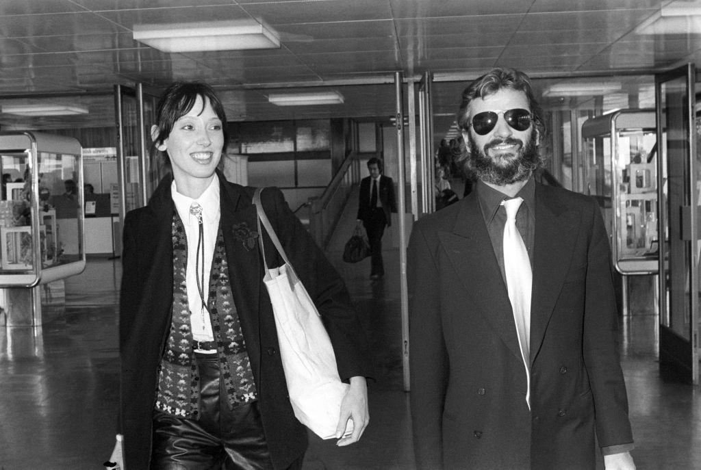 Shelley Duvall with Beatles drummer Ringo Starr at Heathrow Airport in London, 1978.