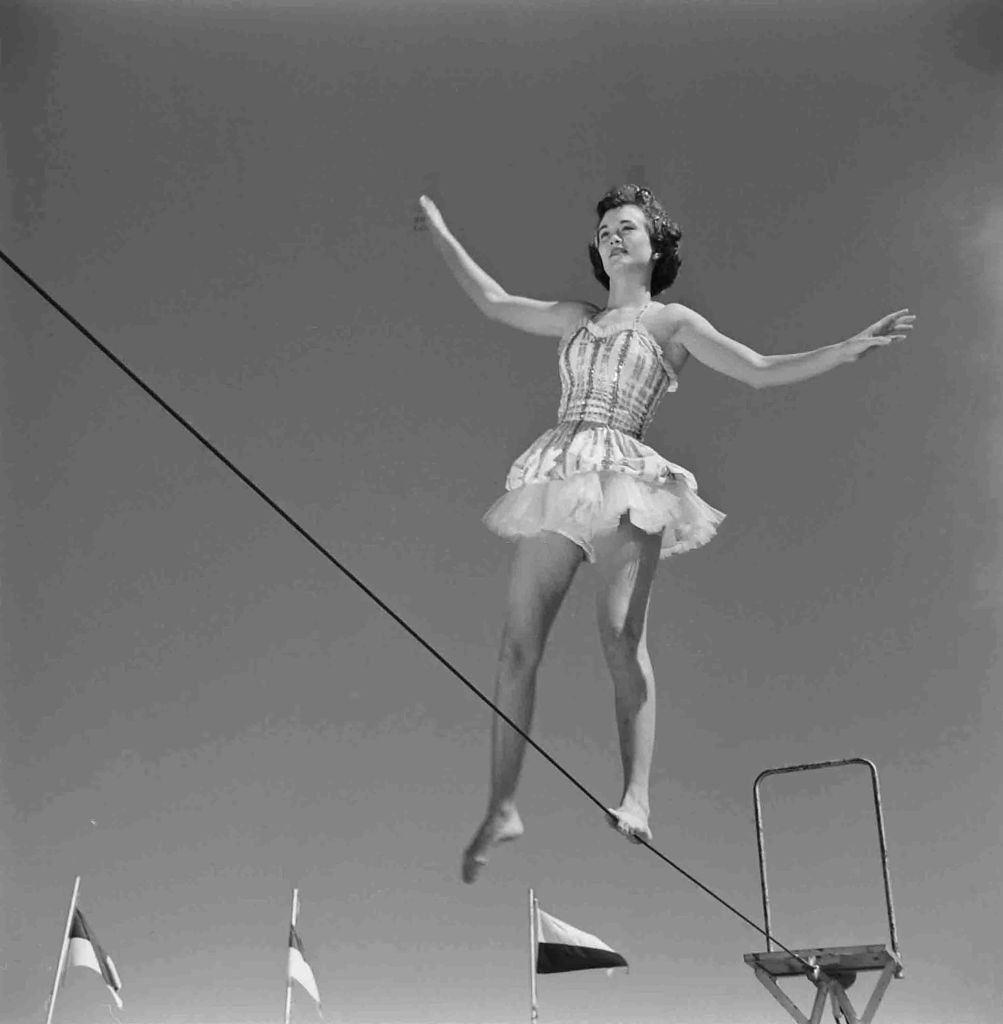 Student at Florida State University practicing tightrope walking during a circus performance course on campus.