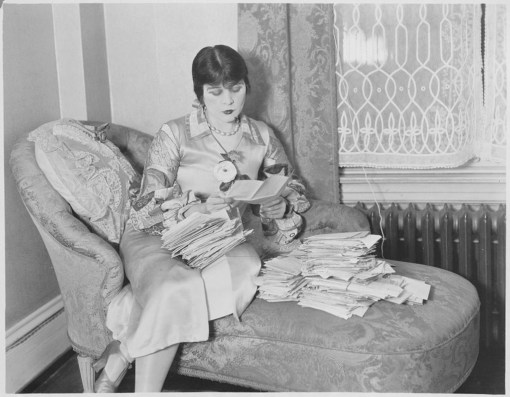 Theda Bara reading her Fans Letters, 1926.