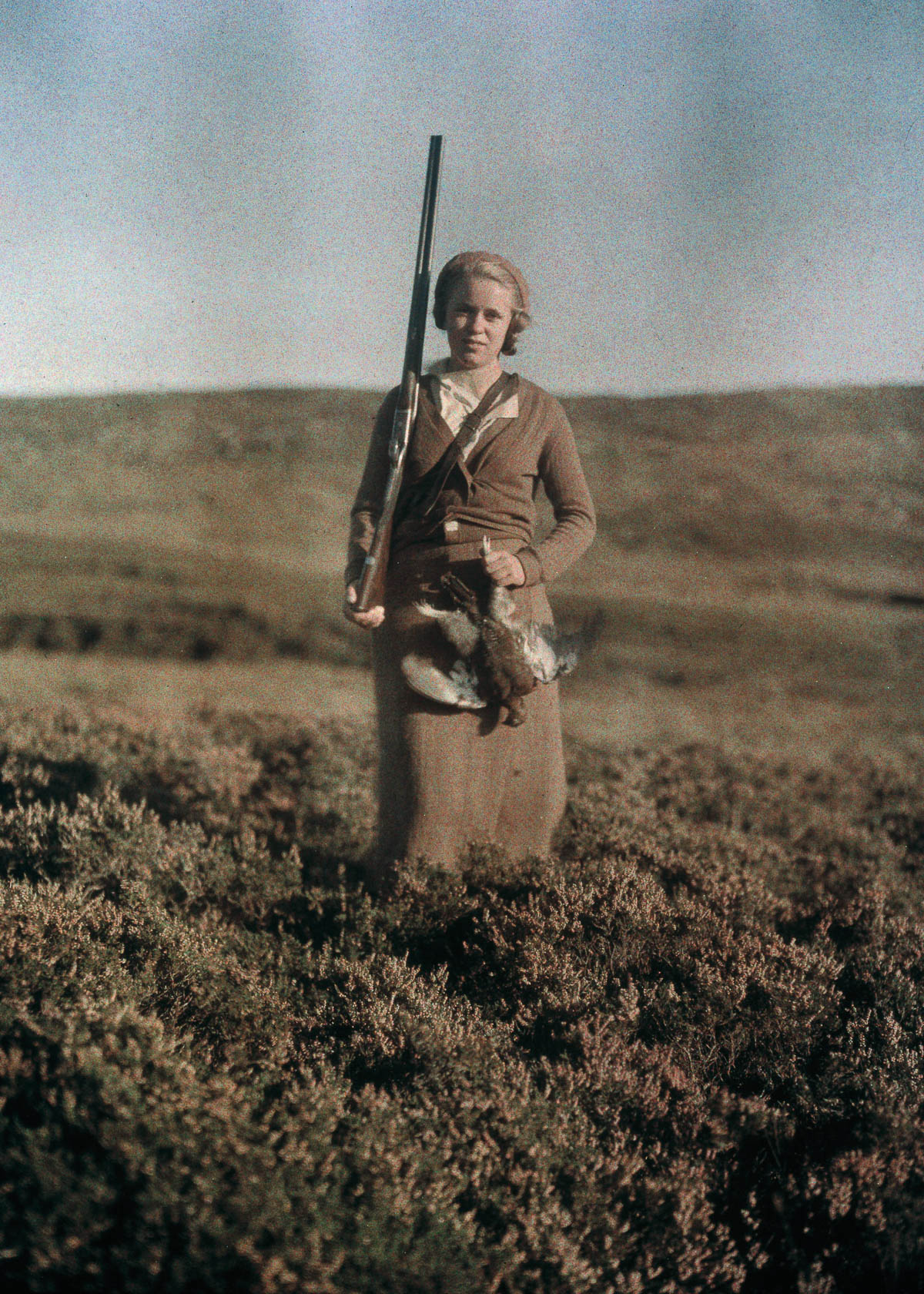 Eva poses after a successful hunt in Scotland.c. 1925