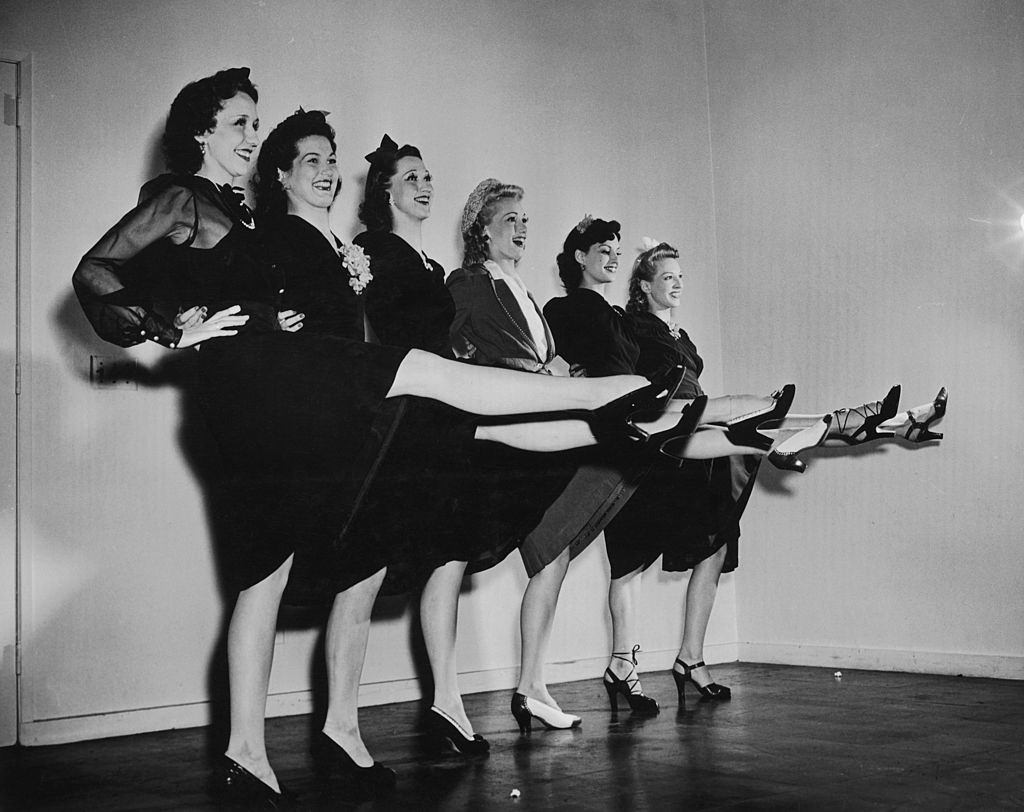 Members of the Radio City Rockettes modelling Legstick, make up to replicate stockings designed to combat wartime shortages, circa 1942.