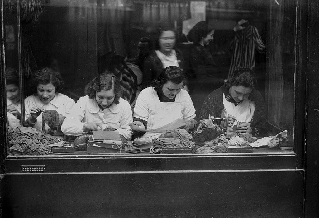 Shop of mending of mesh stockings in Paris during WWII.