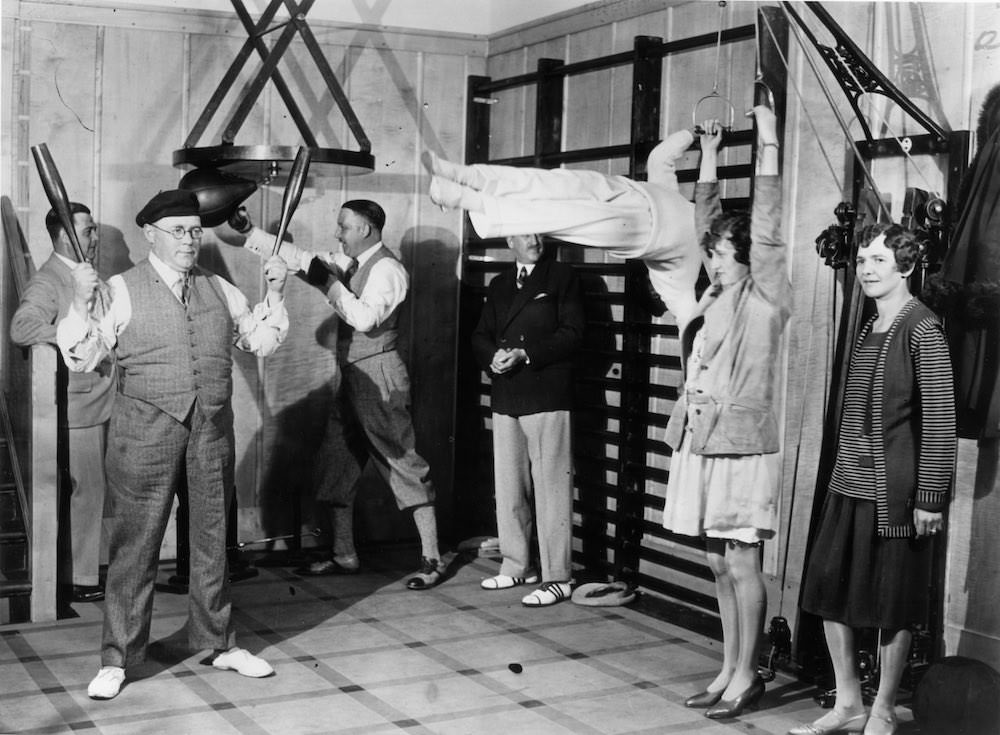 Passengers on the Canadian Pacific liner Duchess of Bedford keep fit in the ship's gymnasium.Dec.1931