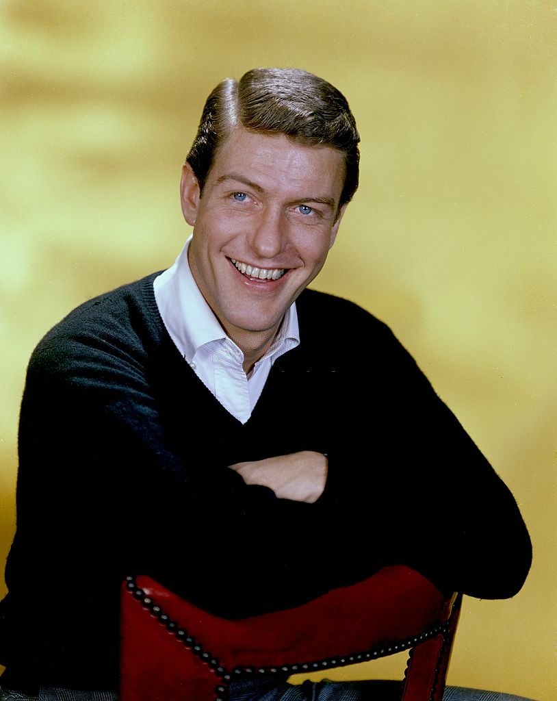 Young Dick Van Dyke posing on a chair, 1960s.