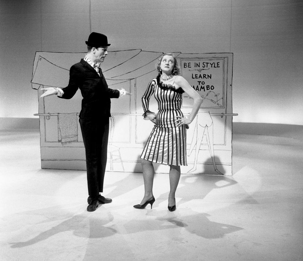 Dick Van Dyke takes mambo and cha-cha dance lessons from Maria Karnilova. January 1960.