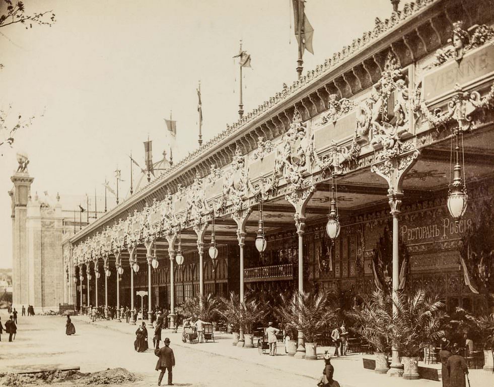 Visitors strolling between exhibitions.