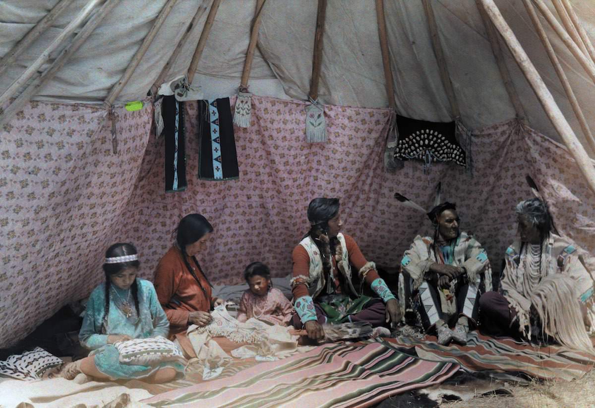 Indian family in their dwelling, tipi. Montana.