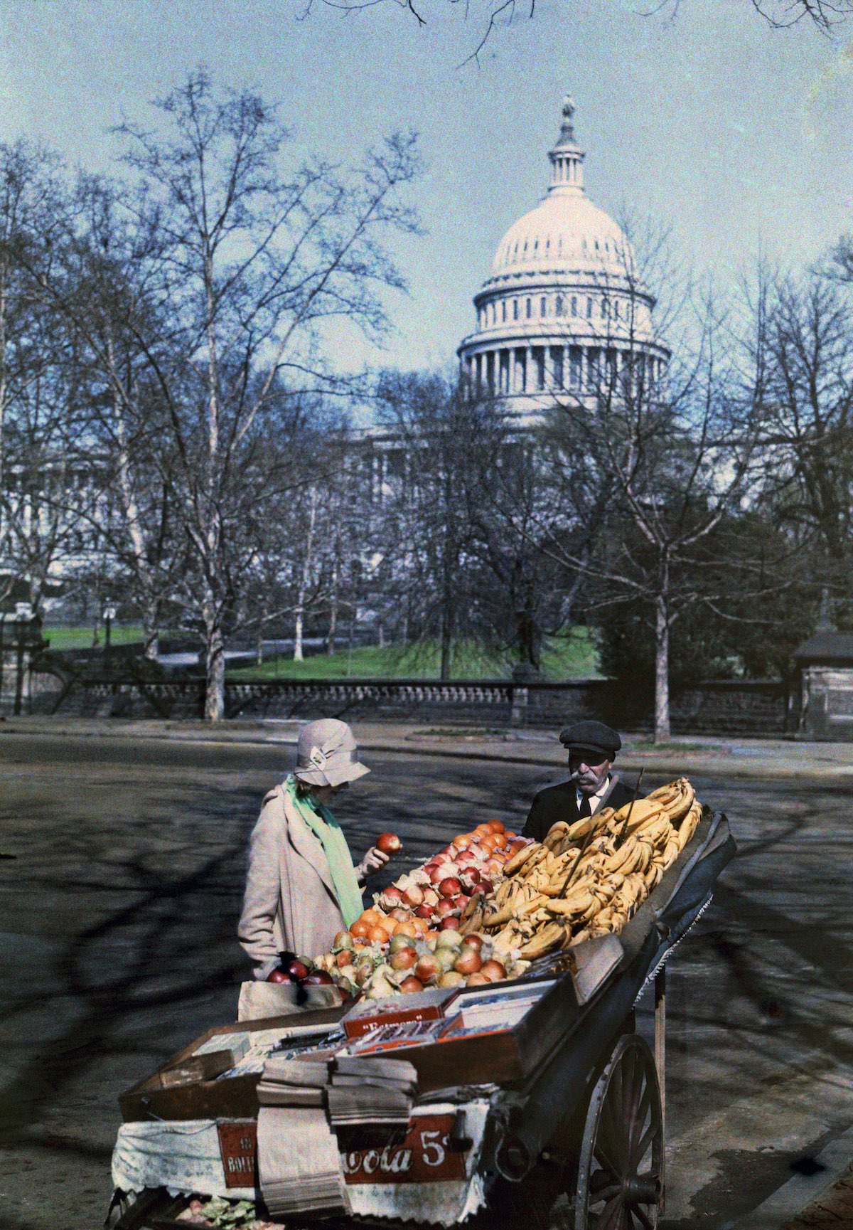 A woman in front of a fruit rack in the US capital. Washington, DC.