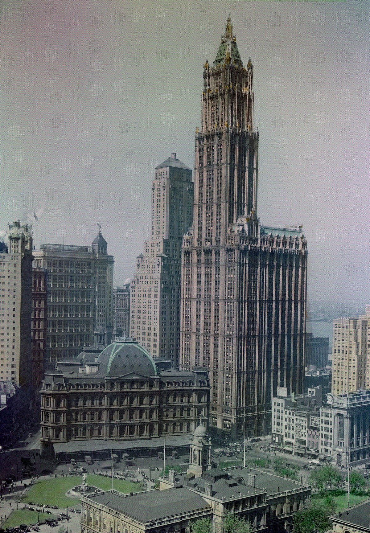 The sixty-story Woolworth Building rises on the New York skyline.