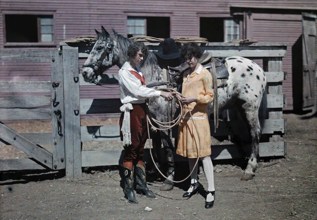 A rider shows her sister how to handle ropes, Fort Worth, Texas.