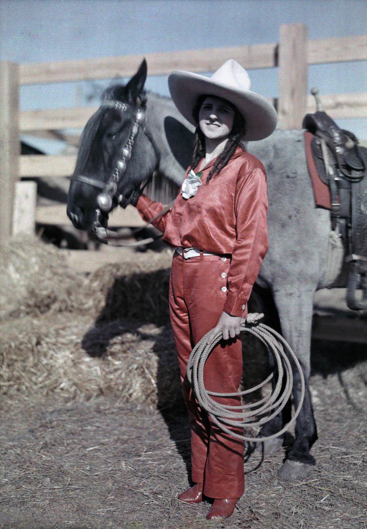 A rider poses with her pony in a rodeo in Texas.
