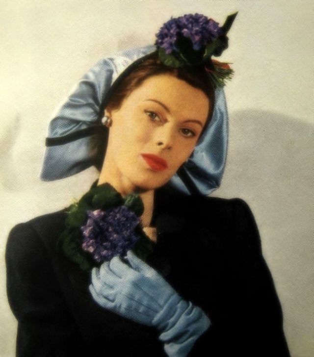 Violets on a flaring snood of blue silk satin, circa 1940s