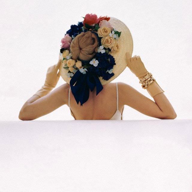 Model wearing broadbrimmed floral hat, 1946