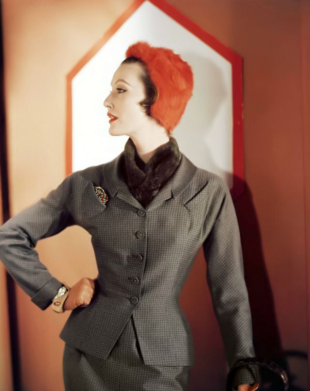 Mary Jane Russell in wool checked suit by Adele Simpson, orange fur cap, 1951