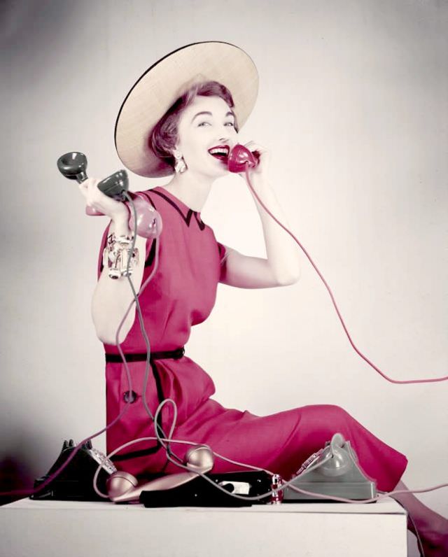Evelyn Tripp in red linen dress by Larry Aldrich and straw hat, April 1953