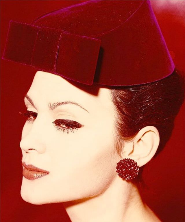 Isabella Albonico is wearing a red velvet hat by Lilly Daché, 1959