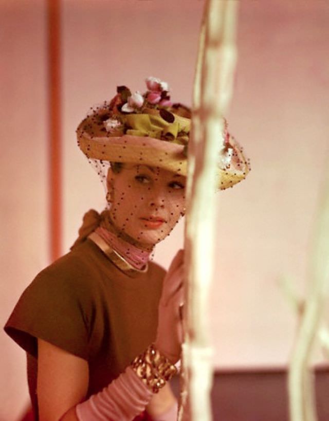 Model wearing bonnet with roses and overveil, March 1945