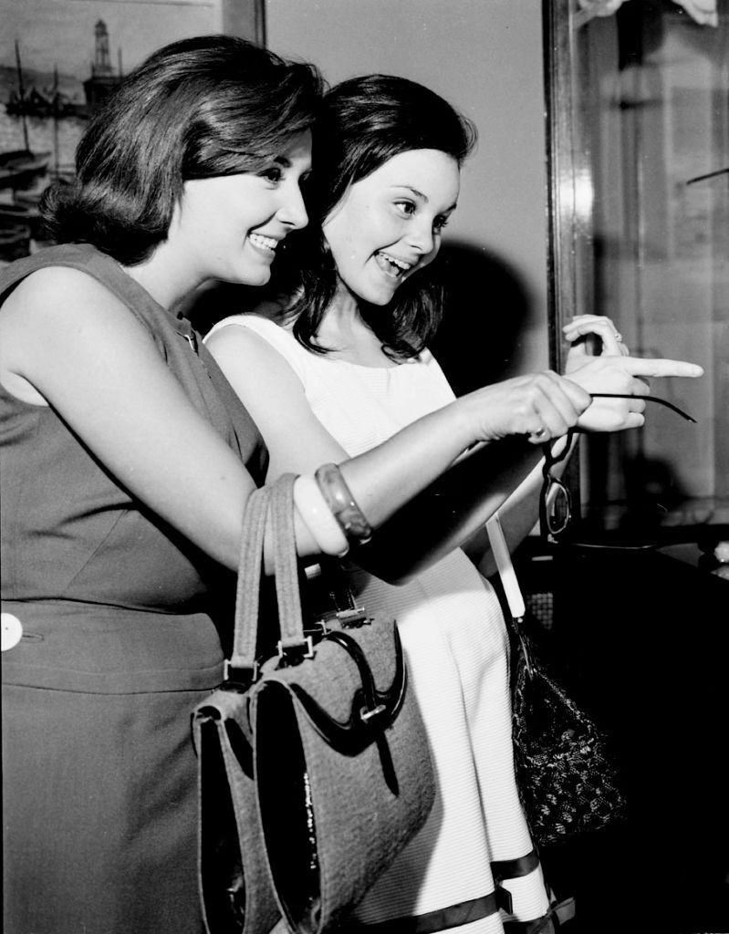 The Spanish actress and singers Recio Durcal (R) and Concha Velasco walking in Barcelona, 1961,