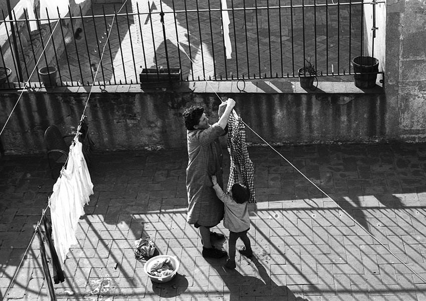 A woman hanging laundry, 1964.