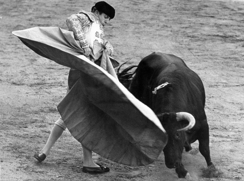 Rafael Martin fighting with the Capa (the wide red cloak), Barcelona, 1960s.