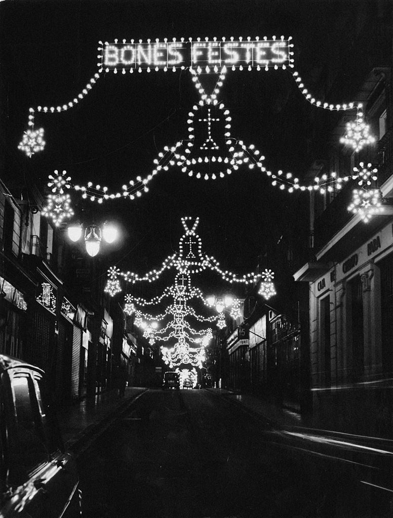A street decorated with Christmas lights in Barcelona, circa 1960.