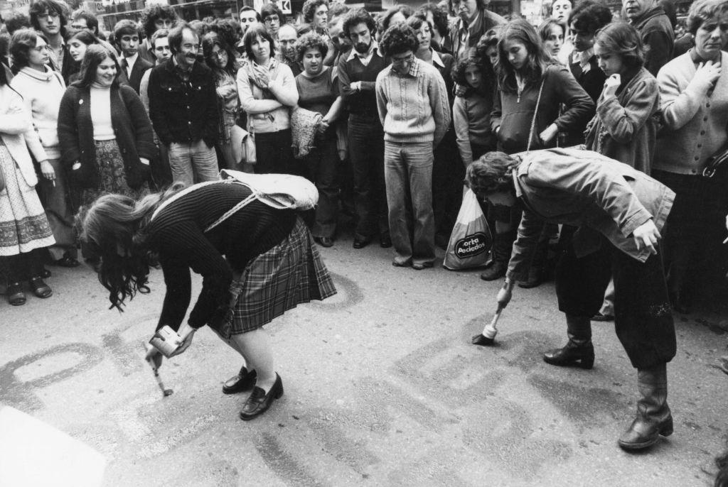 Activists of the PTE (Workers' Party of Spain) painting sogans on the ground during the campaign of the Spanish general elections of 1977 in Barcelona.